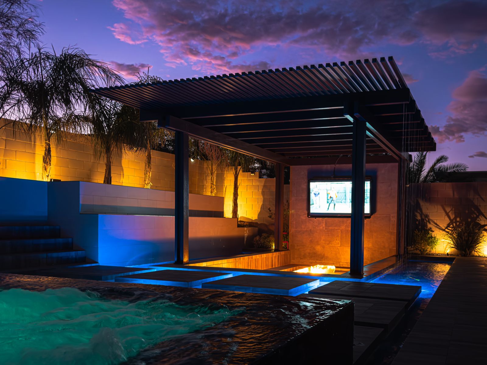 Evening pergola and custom pool by Pools R Us Arizona