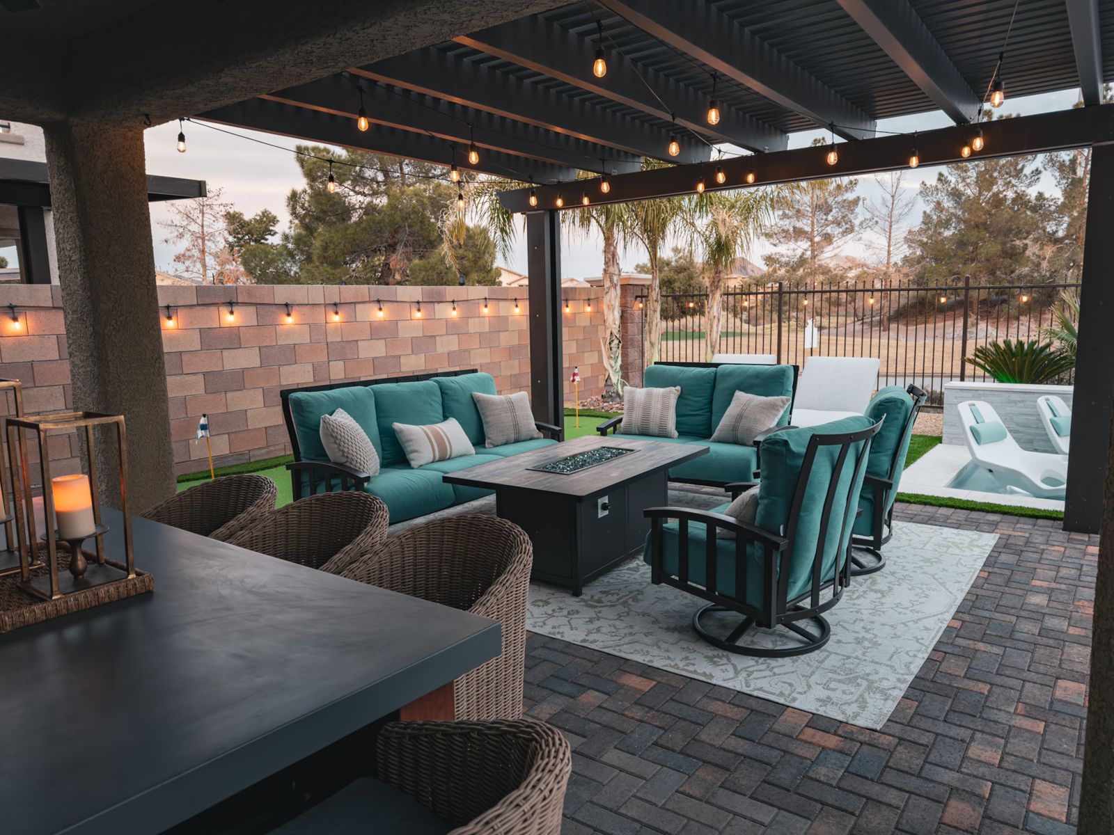 Outdoor lounge with fire table by Pools R Us Arizona